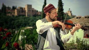 Ali Keeler, founder of the Al Firdaus Ensemble, performs in a recent music video shot in Spain. (Courtesy Al Firdaus Ensemble and Amar Chebib)