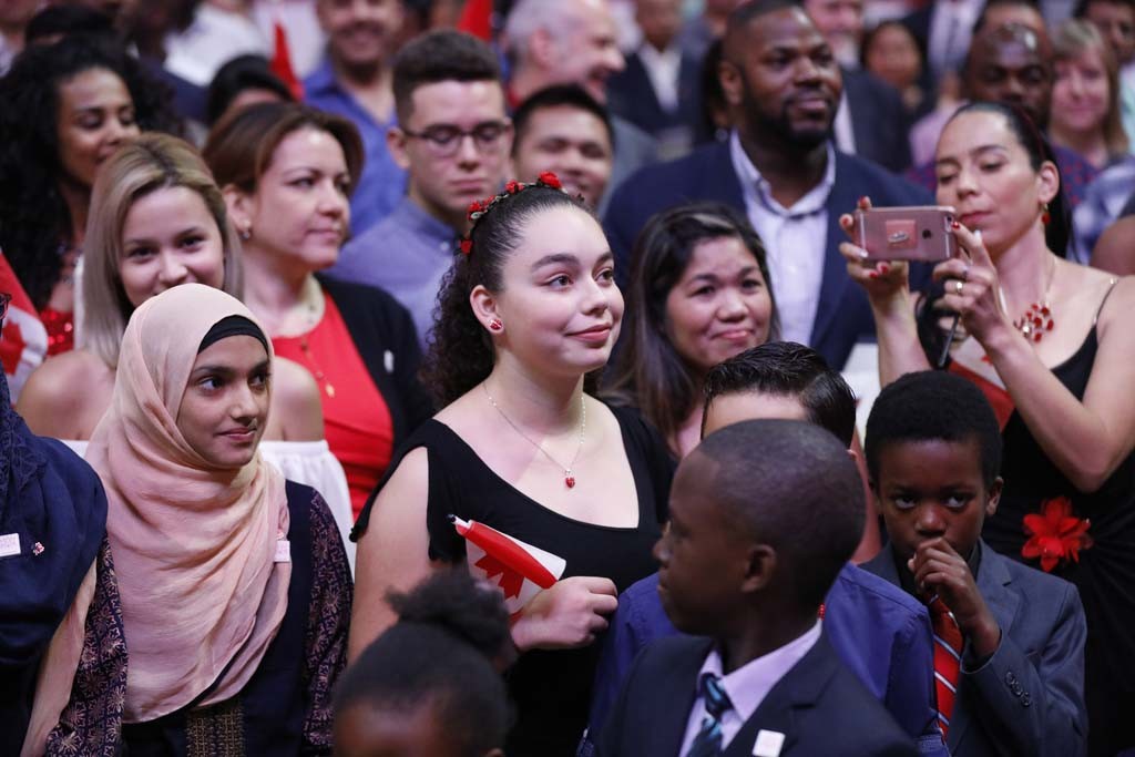 Citizenship ceremony, presided over by Ken Dryden, at the Canadian Tire Centre in Ottawa June 26, 2017. 150 new Canadians were celebrated. Photograph by Blair Gable