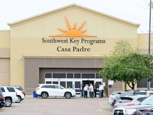 FILE - In this June 18, 2018 file photo, dignitaries take a tour of Southwest Key Programs Casa Padre, a U.S. immigration facility in Brownsville, Texas, where children who have been separated from their families are detained. The American Civil Libe