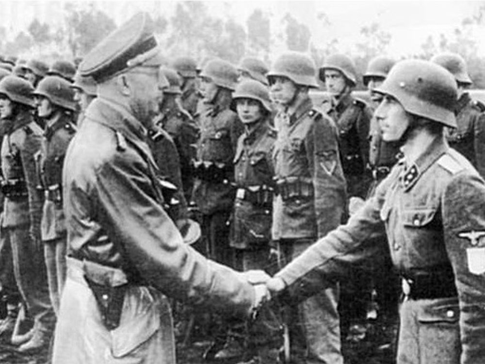 SS leader Heinrich Himmler greets members of the 14th SS Division during the Second World War. Police say graffiti left on an Oakville monument to the SS division is being investigated as a hate-motivated crime. (Photo courtesy US Holocaust Memorial Museum)